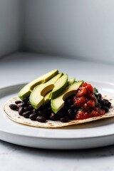 Black bean tacos with salsa and avocado closeup.