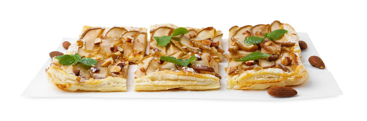 Pieces of tasty puff pastry pie with pears, mint and almonds isolated on white