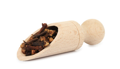 Dry clove buds in wooden scoop on white background. Aromatic spice