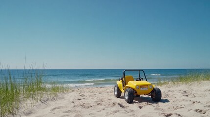 A vibrant yellow dune buggy drifts across sandy beach dunes under bright midday sunlight by the ocean