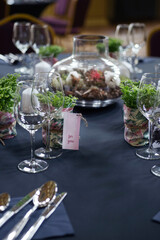 Elegant table setting with selaginella plants as party favors. Watercolor place cards.