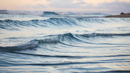 Serene ocean waves gently rolling onto the shore, reflecting the soft hues of the sky. A tranquil seascape evoking calm and natural beauty at dusk. Perfect for relaxation imagery.