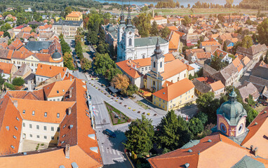A panoramic aerial view of Sremski Karlovci highlights the stunning summer landscape, with its...