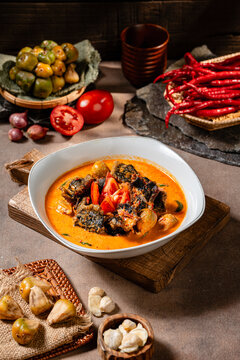 Fried eel with asam cikala or belut asam cikala cooked in spicy sour curry is a popular dish made from freshwater eel from sumatra