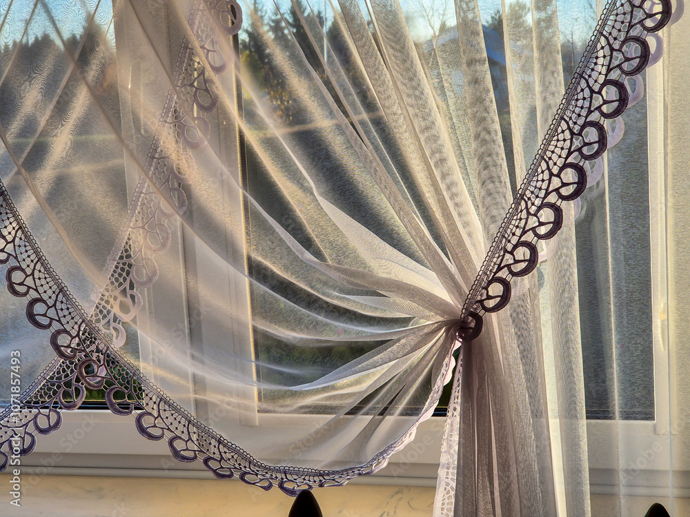 Poster a close-up view of delicate lace curtains gently flowing in the sunlight, creating a soft and ethere