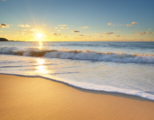 Sandy seashore at sunset.