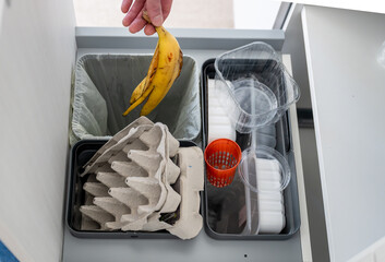 recycling bins for waste sorting in the kitchen for recycle. Plastic, paper and bio. Sorting waste...