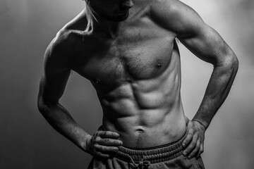 A young shirtless muscluar man