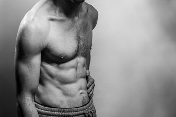 A young shirtless muscluar man