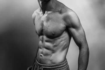 A young shirtless muscluar man