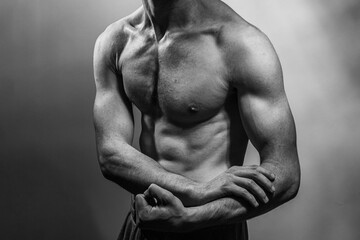 A young shirtless muscluar man