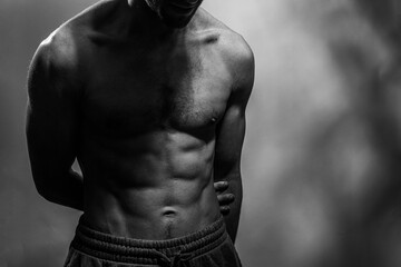 A young shirtless muscluar man