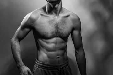 A young shirtless muscluar man