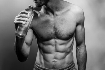 A young shirtless muscluar man