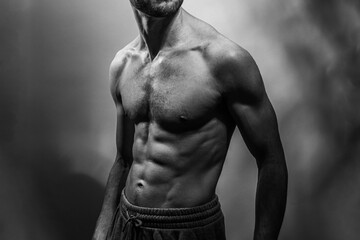 A young shirtless muscluar man