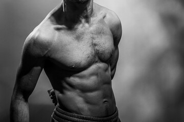 A young shirtless muscluar man