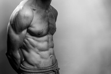 A young shirtless muscluar man