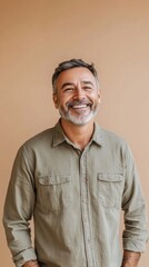 Portrait of happy casual mature man smiling, senior age man with gray hair, Isolated on beige background, copy space