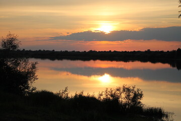 Obraz premium sunset over the river