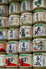 Sake barrels offered for good luck with business in Meiji Shrine, in tokyo.