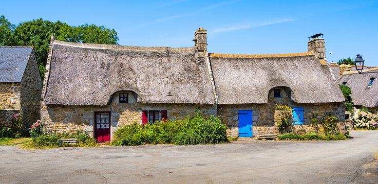 Traditional thatched roof cottage houses in the charming village of Kerascoet, Brittany