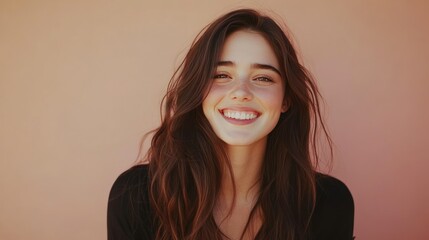 Fototapeta premium Bright Smile of a Young Woman Against a Soft Background