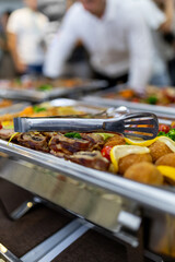 A vibrant buffet with assorted dishes and garnishes at a catered event