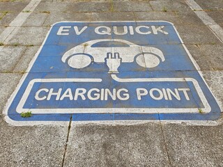 Fototapeta premium EV charging point signage. EV charging station signage on the floor