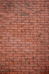 Neatly arranged red brick wall with a classic, textured look