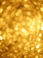 Fototapeta premium Abstract golden glittering background with shimmering particles and soft bokeh lights, background, celebration