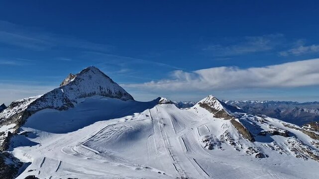 Sunny day on Hintertuxer glacier in Austrian Alps. Snow mountains in Europe. Ski resort on a beautiful sunny day.