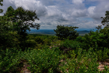 Panoramic nature background from a viewpoint on a high mountain overlooking the scenery below, river, road, rocks, trees, the beauty of nature during a trip in Khon Kaen, Thailand.