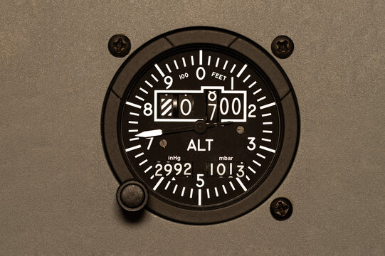 Cockpit Altimeter, set into the panel of a commercial aircraft. Used to determine the height above sea level of an airplane in flight. Instrument helps pilots fly safely, set to 29.92