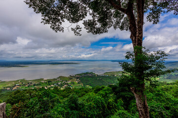 Obraz premium Panoramic nature background from a viewpoint on a high mountain overlooking the scenery below, river, road, rocks, trees, the beauty of nature during a trip in Khon Kaen, Thailand.