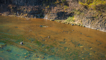 Autumn scenery of the Hantan River Columnar Joint Road, with canyons and cliffs formed by the river flowing through the volcanic terrain.