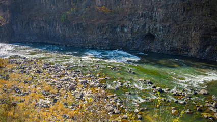 Autumn scenery of the Hantan River Columnar Joint Road, with canyons and cliffs formed by the river flowing through the volcanic terrain.