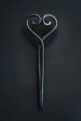 A unique pair of scissors with a heart shape handle, ideal for crafts and DIY projects