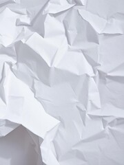Obraz premium A close-up shot of a crumpled white paper with soft shadows, wrinkled, studio