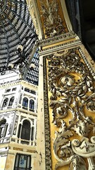 A glimpse and architectural details of the Galleria di Napoli in the center of the city.