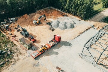 construction with with excavator and materials aerial view no people