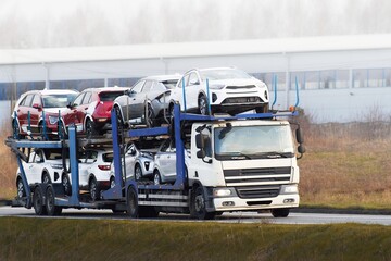 Tow truck hauling car after highway breakdown