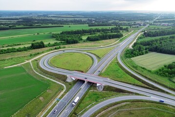 Aerial view of complex highway interchange and surrounding countryside