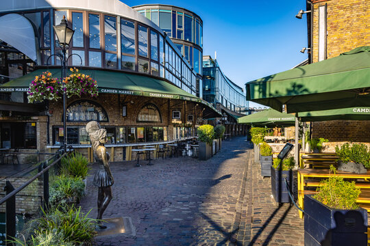 Camden Market in Camden Town, with a bronze statue of the Grammy award winning local singer song writer Amy Winehouse by Scott Eaton,  London.
