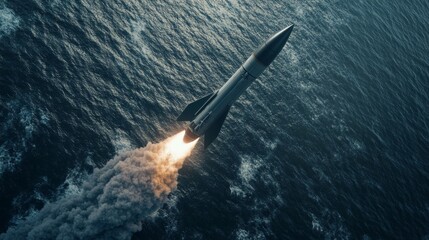 Fototapeta premium Rocket Launch Over Ocean at Sunset