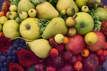 Summery arrangement of fruits and flowers