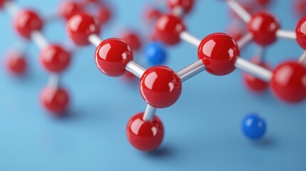 Obraz premium Close-up View of Colorful Molecular Structure Featuring Red and Blue Atoms on a Soft Blue Background for Educational and Scientific Concepts