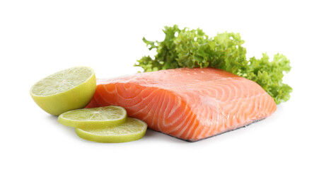 Piece of fresh salmon, lime and lettuce isolated on white