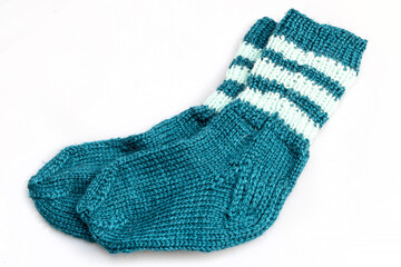 Warm, woolen knitted socks isolated on white background. Warm socks made of wool for winter season. 