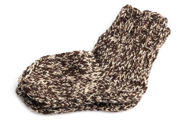 Warm, woolen knitted socks isolated on white background. Warm socks made of wool for winter season. 
