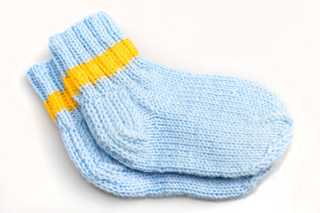 Warm, woolen knitted socks isolated on white background. Warm socks made of wool for winter season. 